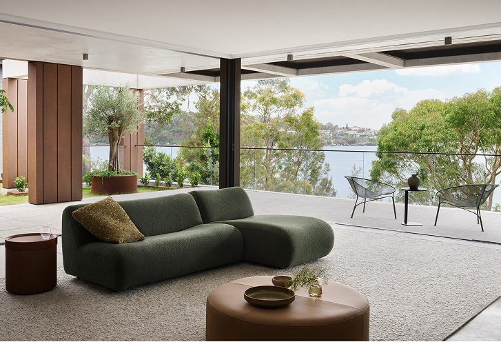 Modern living room with green sofa